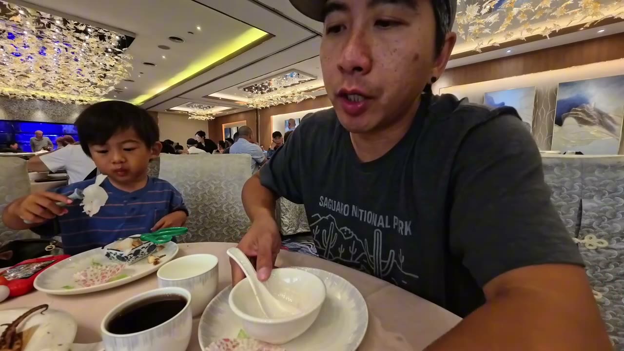 Michael and Spencer eating dim sum in Toronto
