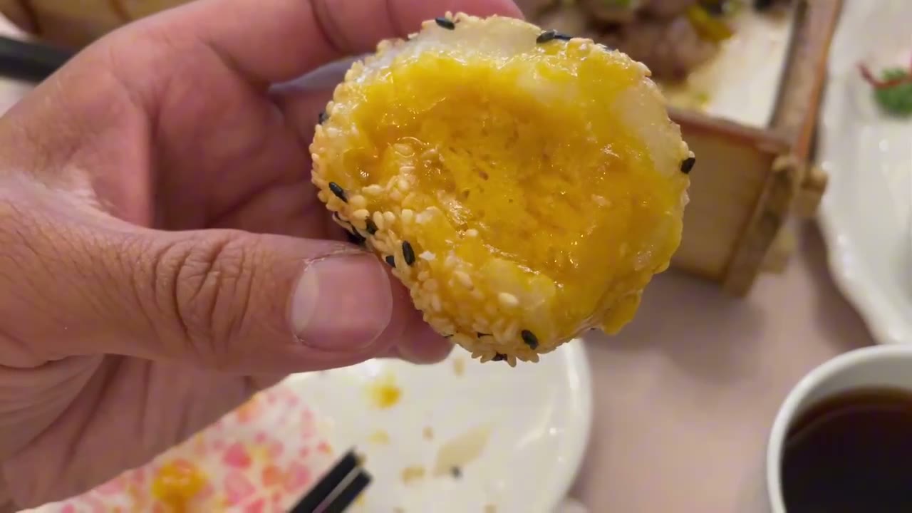 A sesame ball with a salted egg yolk filling