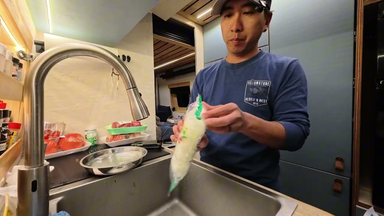 Michael cooking in the van kitchen